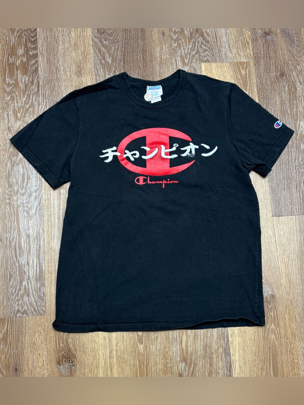 Champion Black Short-Sleeve Tee with Red Logo and White Japanese Text